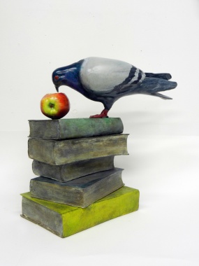 Pigeon tasting an apple